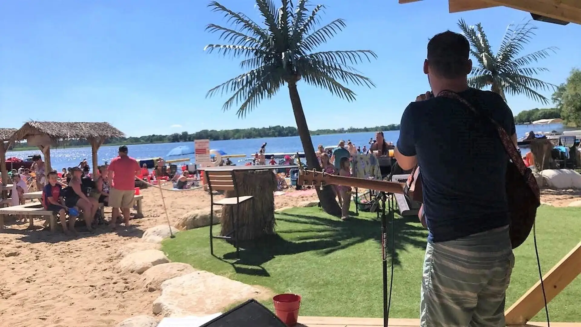 Musician's view of the crowd, palms, and lake mid-set